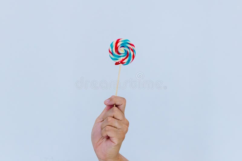 Child`s Hand Holding Big Colorful Lollipop Stock Photo - Image of ...