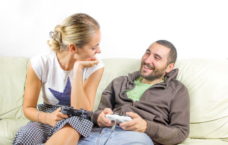 Fun couple look at each other - play video games