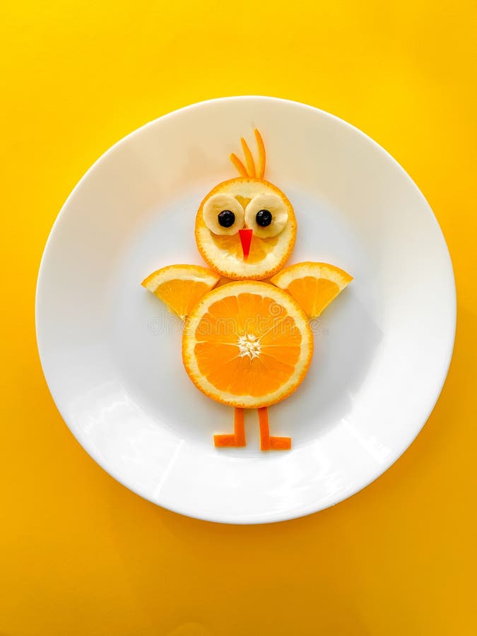 Fun Food for Kids, Orange Chicken on Gray Background Stock Photo
