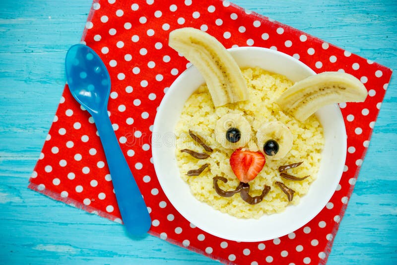 Fun and healthy breakfast idea for kids - Easter bunny millet porridge with milk royalty free stock images Fun and healthy breakfast idea for kids - Easter bunny millet porridge with milk royalty free stock images