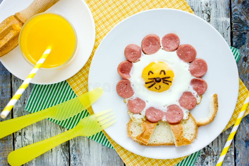 Fried egg with sausage and toast shaped cute lion