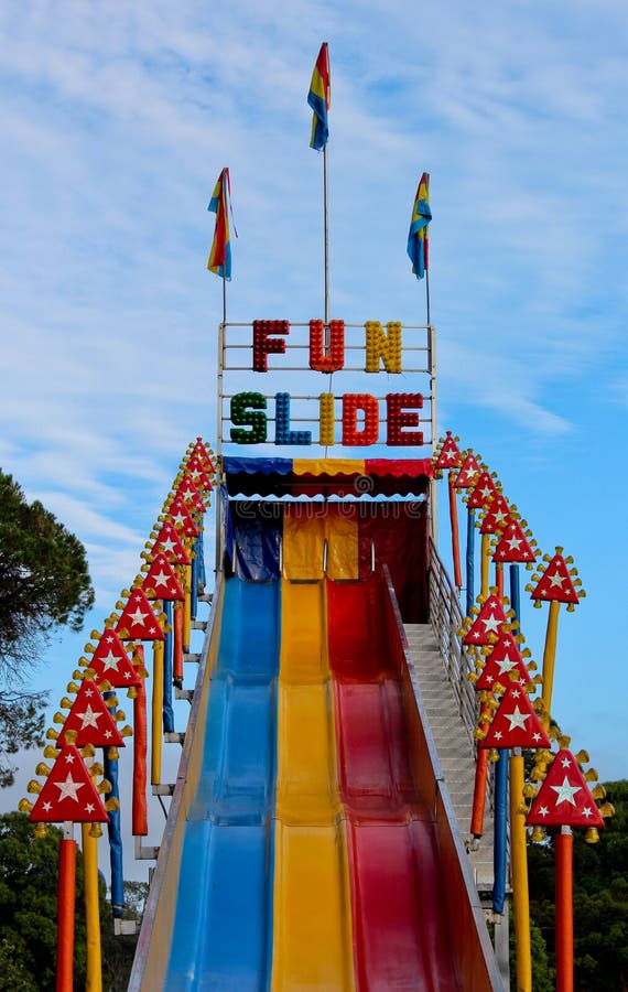 Fun Slide Ride at Outdoor Carnival Stock Image - Image of carnival