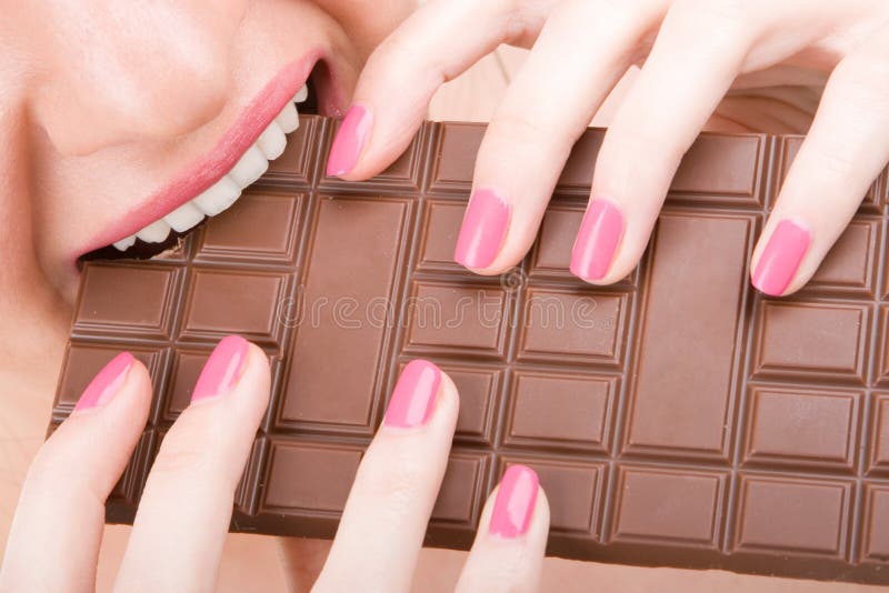 Fun woman eating chocolate