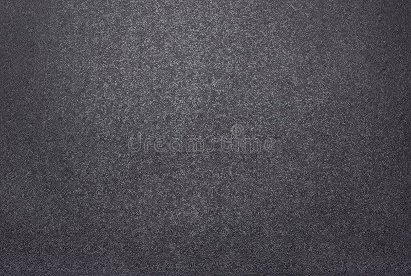 Fundal texturat negru și dur, iluminat cu lumină slabă stock photo