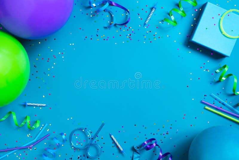 Bright festive blue background with birthday party accessories, copy space. Bright festive blue background with birthday party accessories, copy space