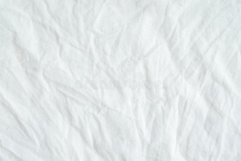 Textura de tecido de algodão branco enrugado, fundo imagem de stock