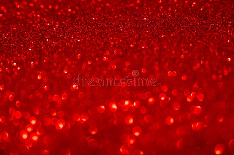 Defocused abstract red glitter background. Sequins on paper. Defocused abstract red glitter background. Sequins on paper