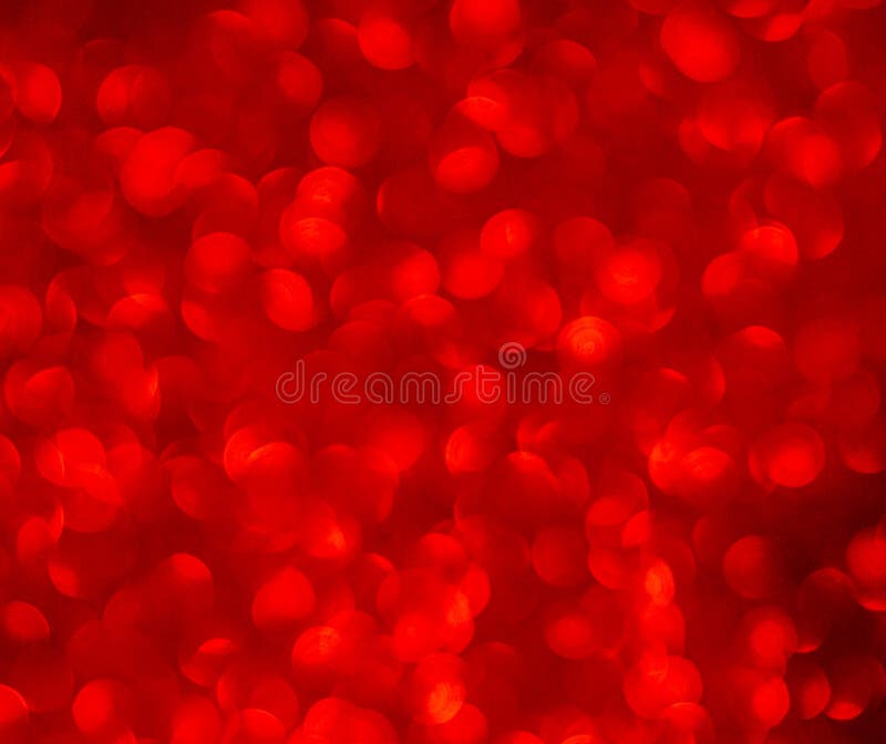 Defocused abstract red glitter background. Sequins on paper. Defocused abstract red glitter background. Sequins on paper