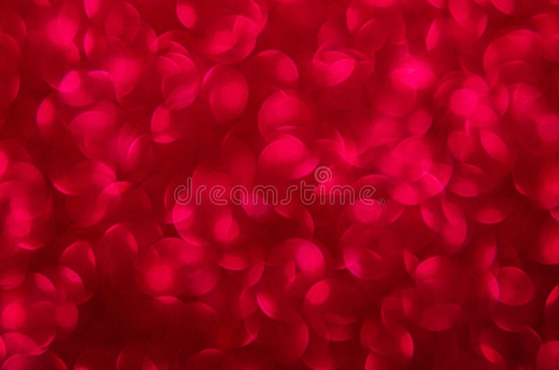 Defocused abstract red glitter background. Sequins on paper. Defocused abstract red glitter background. Sequins on paper