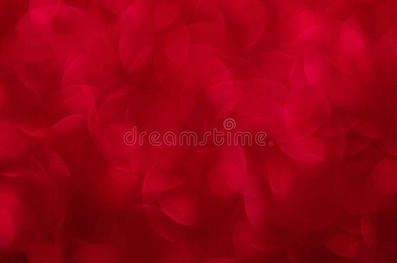 Defocused abstract red glitter background. Sequins on paper. Defocused abstract red glitter background. Sequins on paper