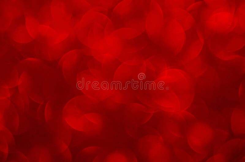 Defocused abstract red glitter background. Sequins on paper. Defocused abstract red glitter background. Sequins on paper