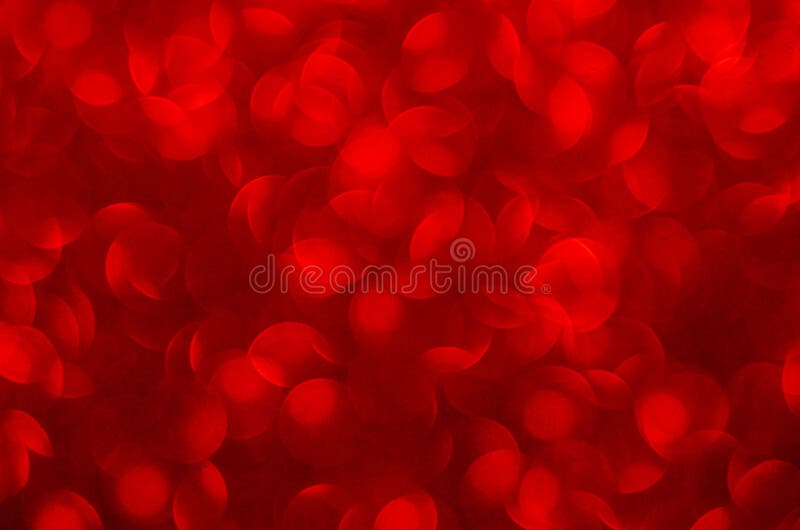 Defocused abstract red glitter background. Sequins on paper. Defocused abstract red glitter background. Sequins on paper