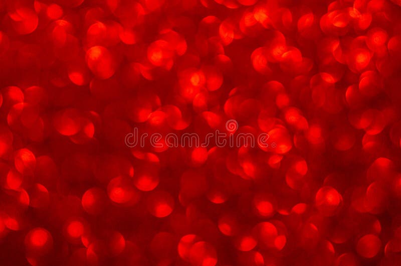 Defocused abstract red glitter background. Sequins on paper. Defocused abstract red glitter background. Sequins on paper