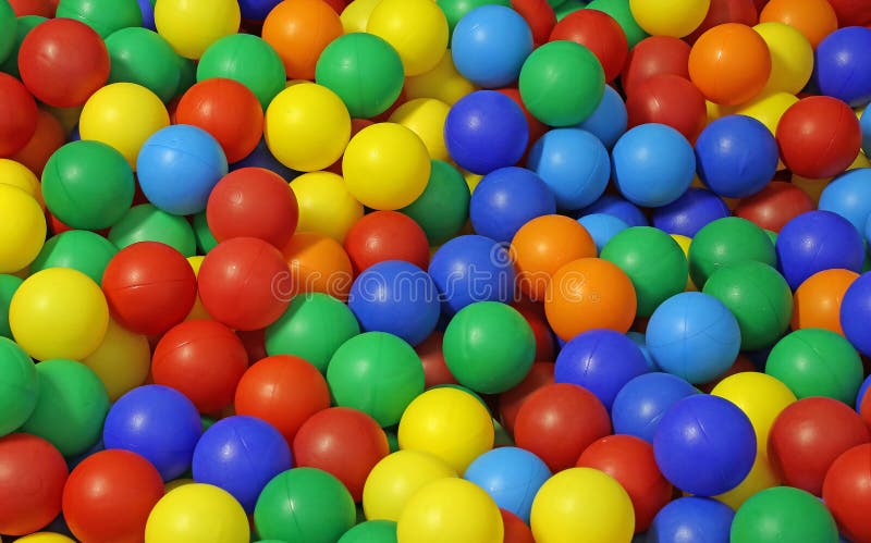 Fundo de muitas bolas plásticas coloridas em uma associação imagens de stock Fundo de muitas bolas plásticas coloridas em uma associação imagens de stock