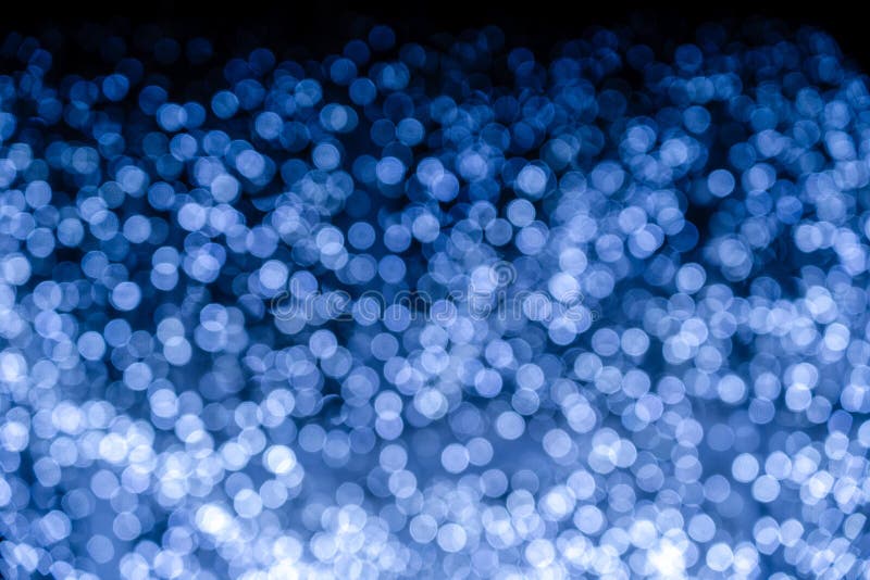 Fundo natalício abstrato com efeito bokeh azul imagem de stock