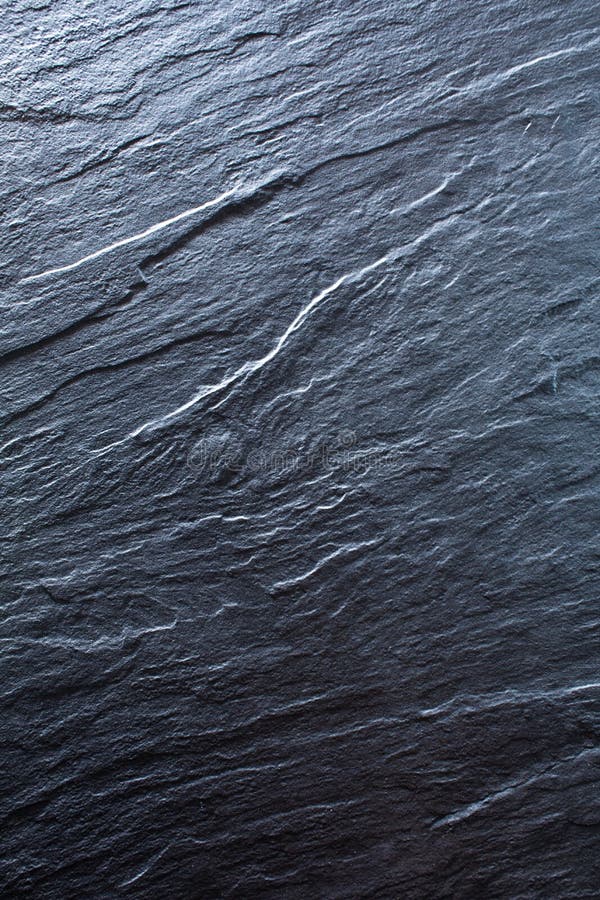 Fundo de pedra cinzento, preto escuro Balanç a textura Fundo preto do vertical da ardósia