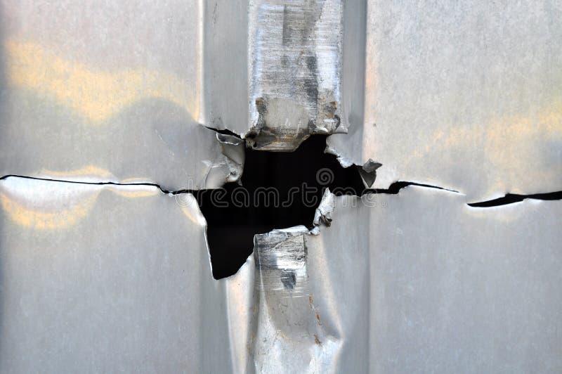 Fundo do metal do furo foto de stock royalty free Fundo do metal do furo foto de stock royalty free