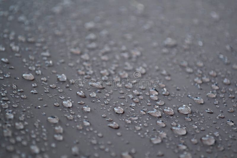Fundo - gotas da água na tela cinzenta fotografia de stock Fundo - gotas da água na tela cinzenta fotografia de stock
