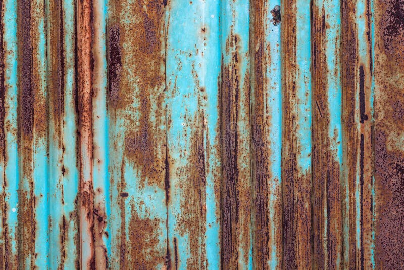 Fundo oxidado do metal com camadas velhas de pintura azul Textura ru