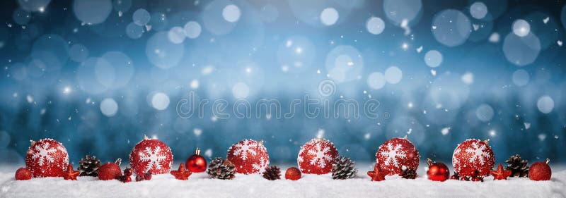 Panoramic christmas ornaments in the snow over winter background. Panoramic christmas ornaments in the snow over winter background