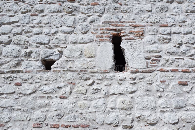 Fundo resistido de Stonewall de uma parede do castelo fotos de stock royalty free
