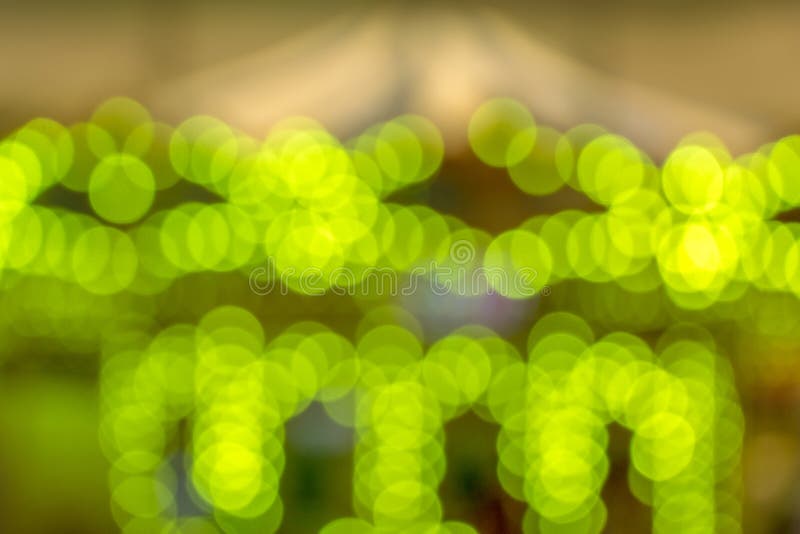 Fundo verde de Bokeh, luz do carrossel imagem de stock Fundo verde de Bokeh, luz do carrossel imagem de stock