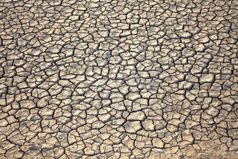 Fundo à terra secado do solo rachado da terra foto de stock