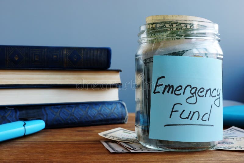 Emergency fund written on the jar with money. Emergency fund written on the jar with money