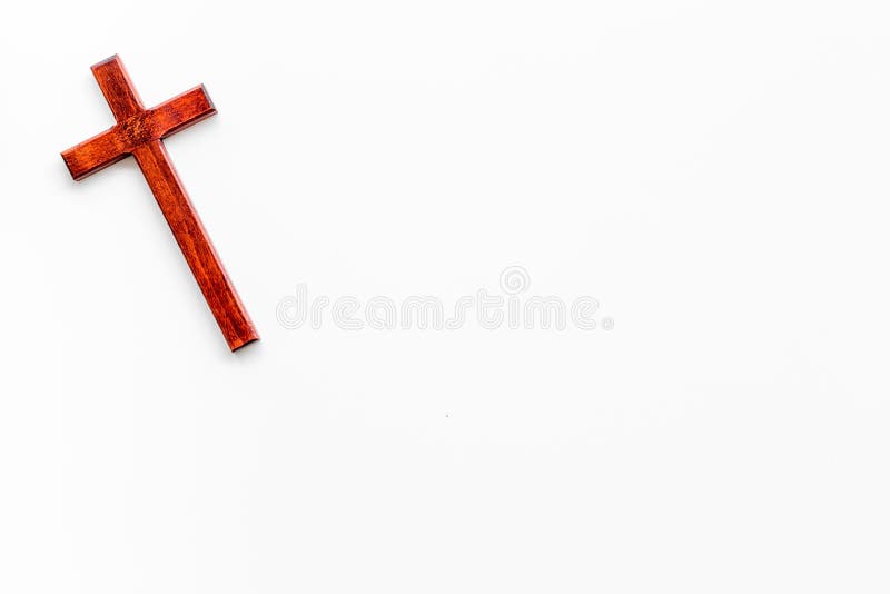 Funeral concept. Wooden cross on white background top view copy space