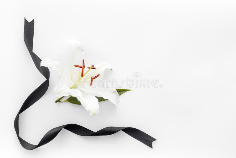 Funeral Lily Flowers with Cross on Dark Stone Background. Mourning ...