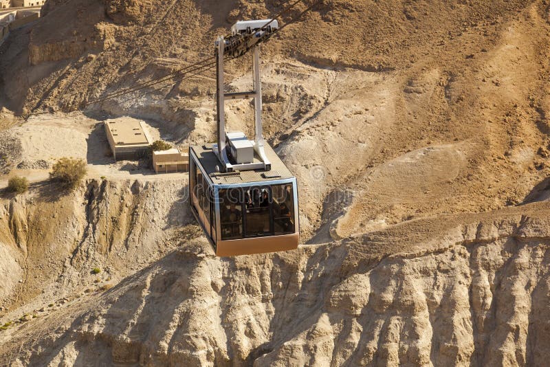 Cable car to ruins of Masada ancient fortress - one of the most visited place in places in country. Israel. Cable car to ruins of Masada ancient fortress - one of the most visited place in places in country. Israel.