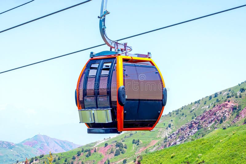 Funicular or cable car for tourists on green mountains and blue sky background in summer. stock image Funicular or cable car for tourists on green mountains and blue sky background in summer. stock image