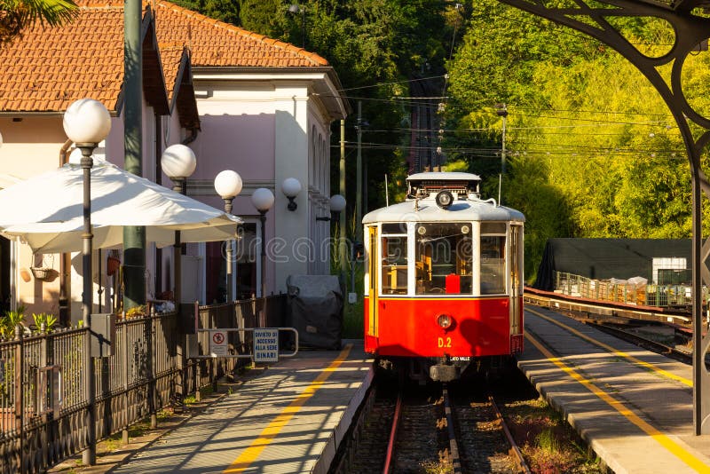 Funicular tramway whith Vintage passenger tram cars. Italian mountain electric train departs from SASSI station to the Basilica Di