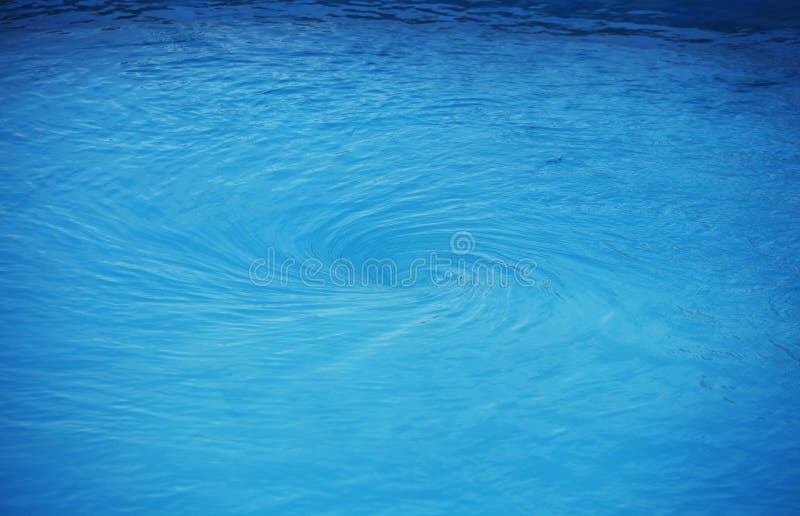 Blue swirling background resembling a water funnel. Whirlpool vortex water stock images, royalty-free photos and pictures