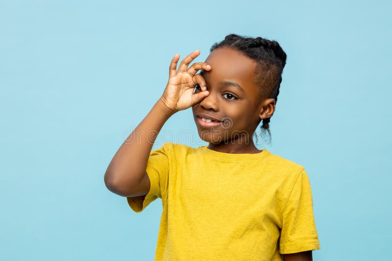 Funny African American little boy showing ok sign stock photo