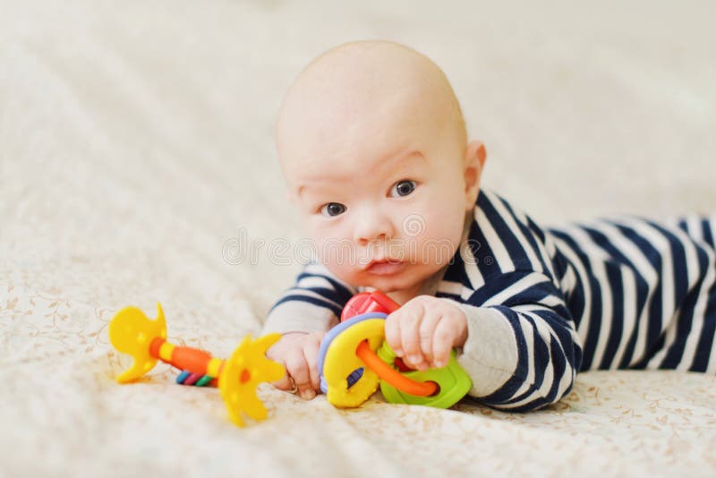 Funny baby on the bed royalty free stock photo