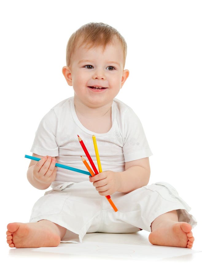 Funny baby boy drawing with color pencils