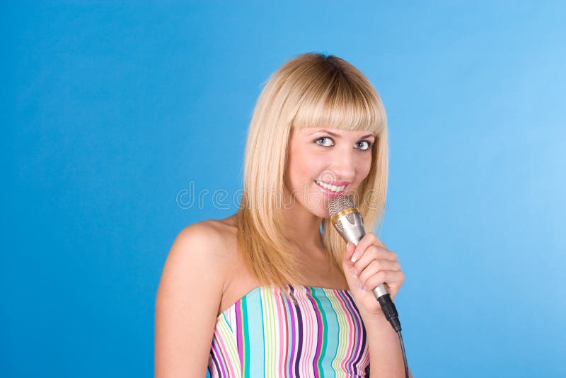 Funny blonde on a blue with a microphone