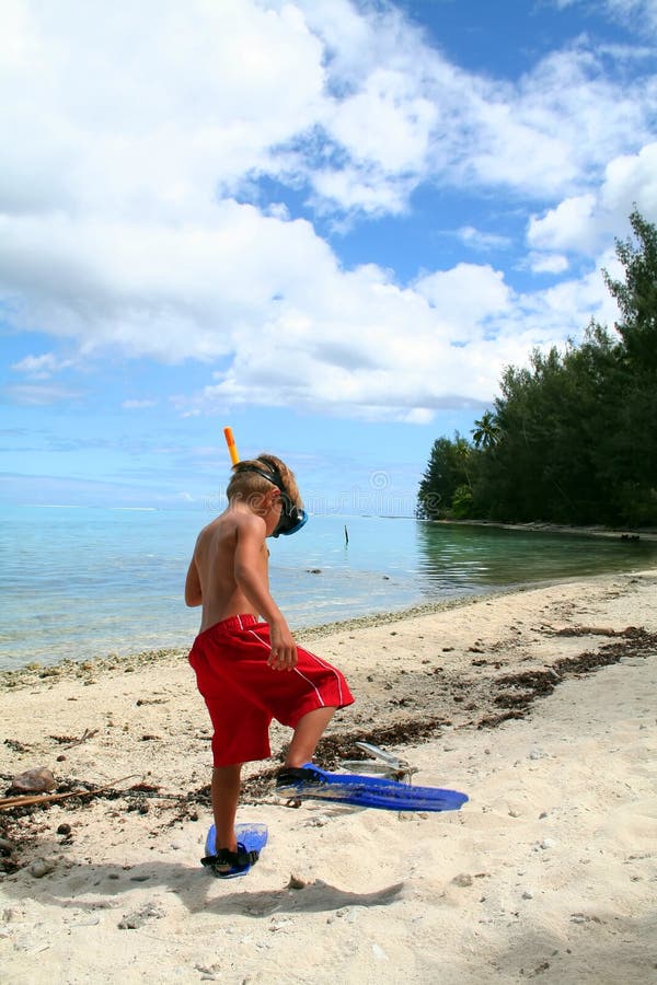 Funny boy walking with fins