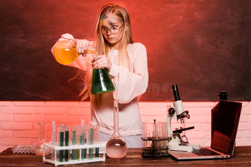 Funny chemical, school child doing experiments in the laboratory. Explosion in the lab. Science and education. Little girl scientist in the laboratory. Chemical experiment
