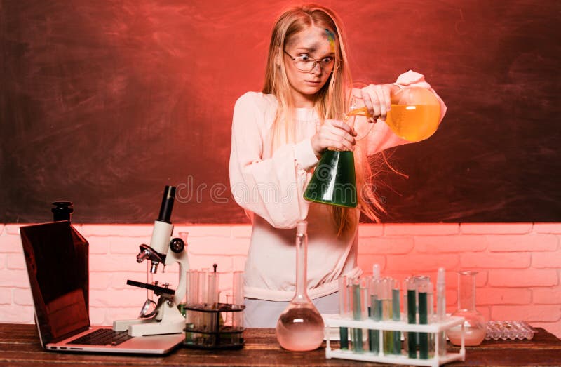 Funny chemical, school child doing experiments in the laboratory. Explosion in the lab. Science and education. Little girl scientist in the laboratory. Chemical experiment