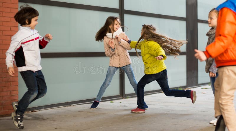 Child`s play catch-up in park