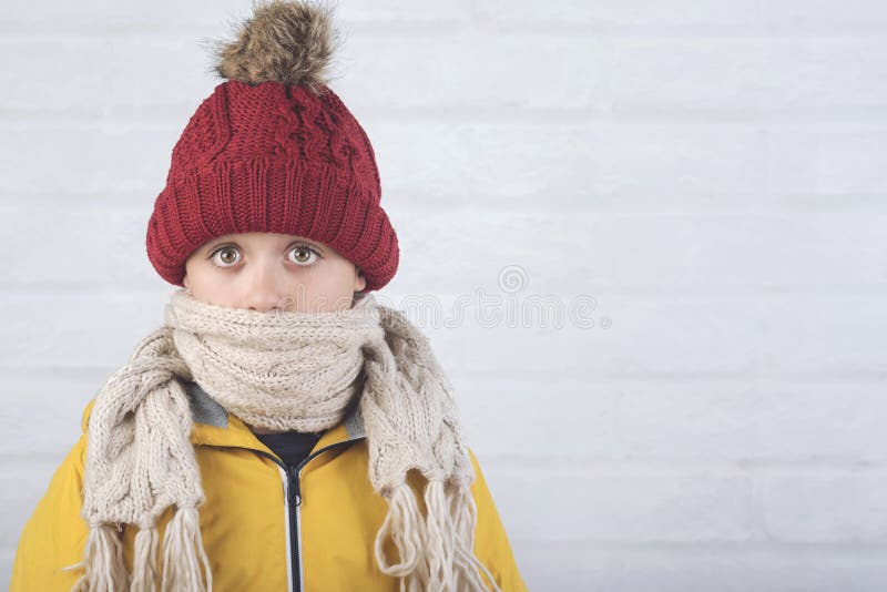 Funny child with winter hat and scarf