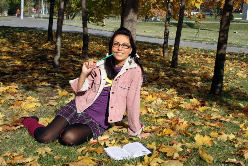 Funny college girl studying outdoor