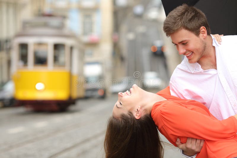 Funny couple flirting and joking in the street