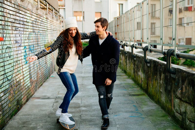Funny couple learning to skate royalty free stock images Funny couple learning to skate royalty free stock images