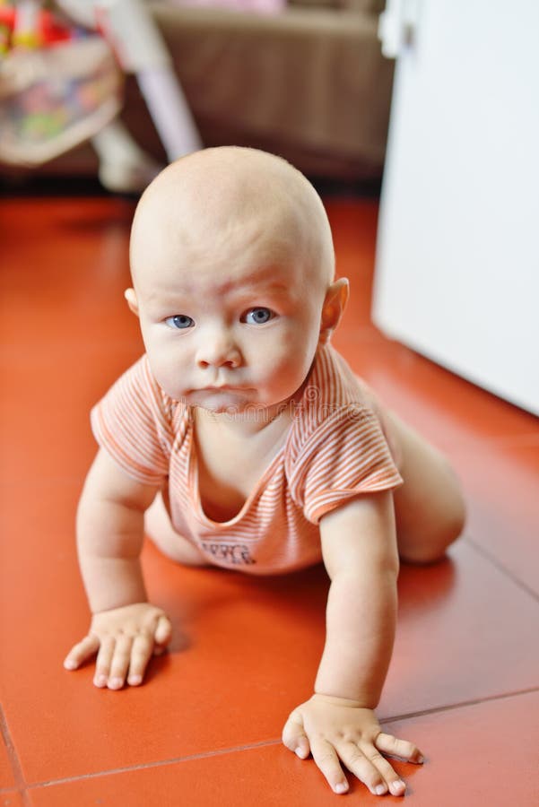 Funny crawling baby stock photos