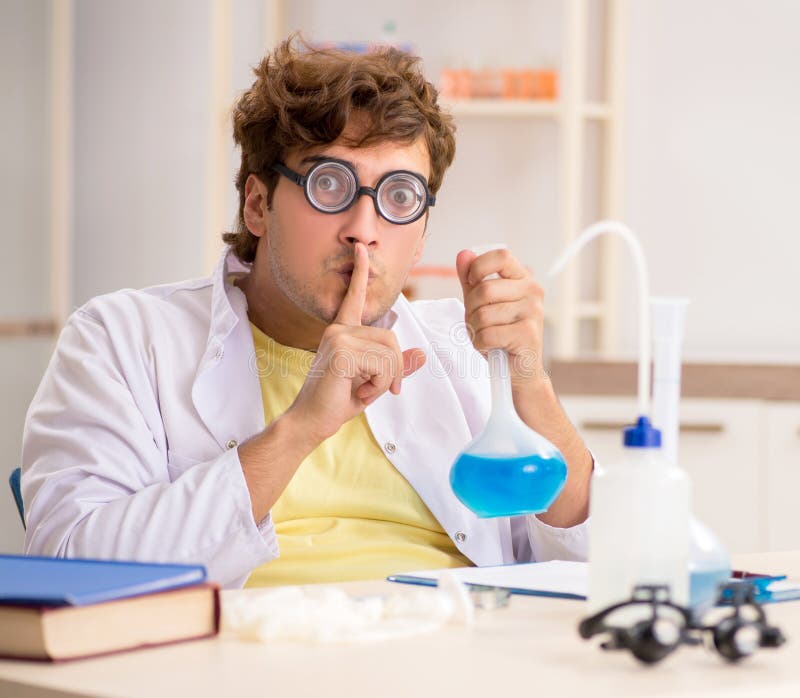 The funny crazy chemist doing experiments and tests