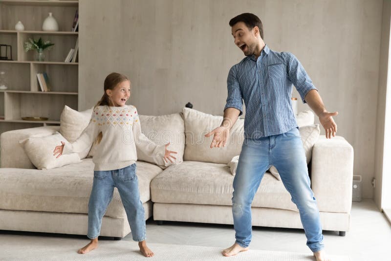 Funny crazy dad and kid dancing to music stock photography
