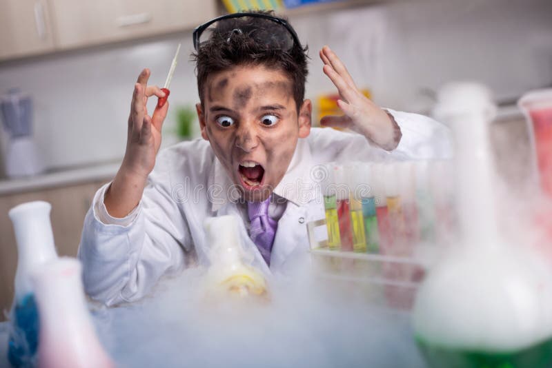 funny crazy scientist boy working in a laboratory